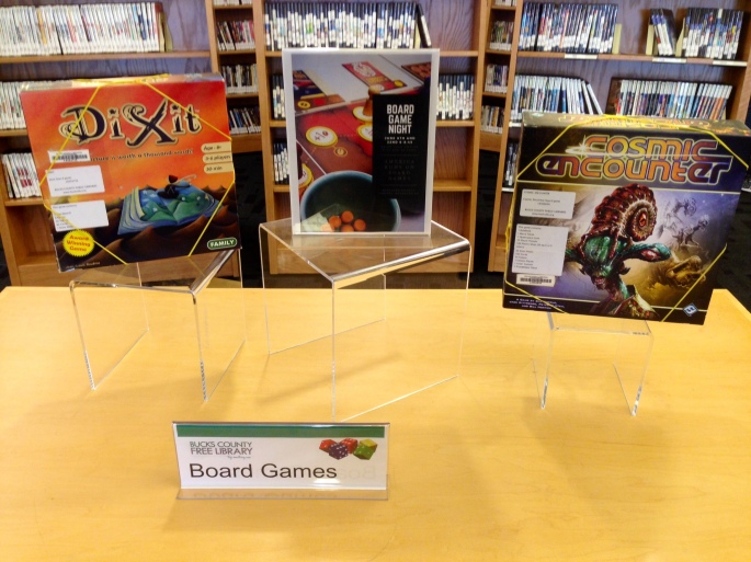Clear Signage, prominent display, library event tie-ins. Only two games left and Dixit was checked out 15 minutes after the picture...poor Cosmic Encounters
